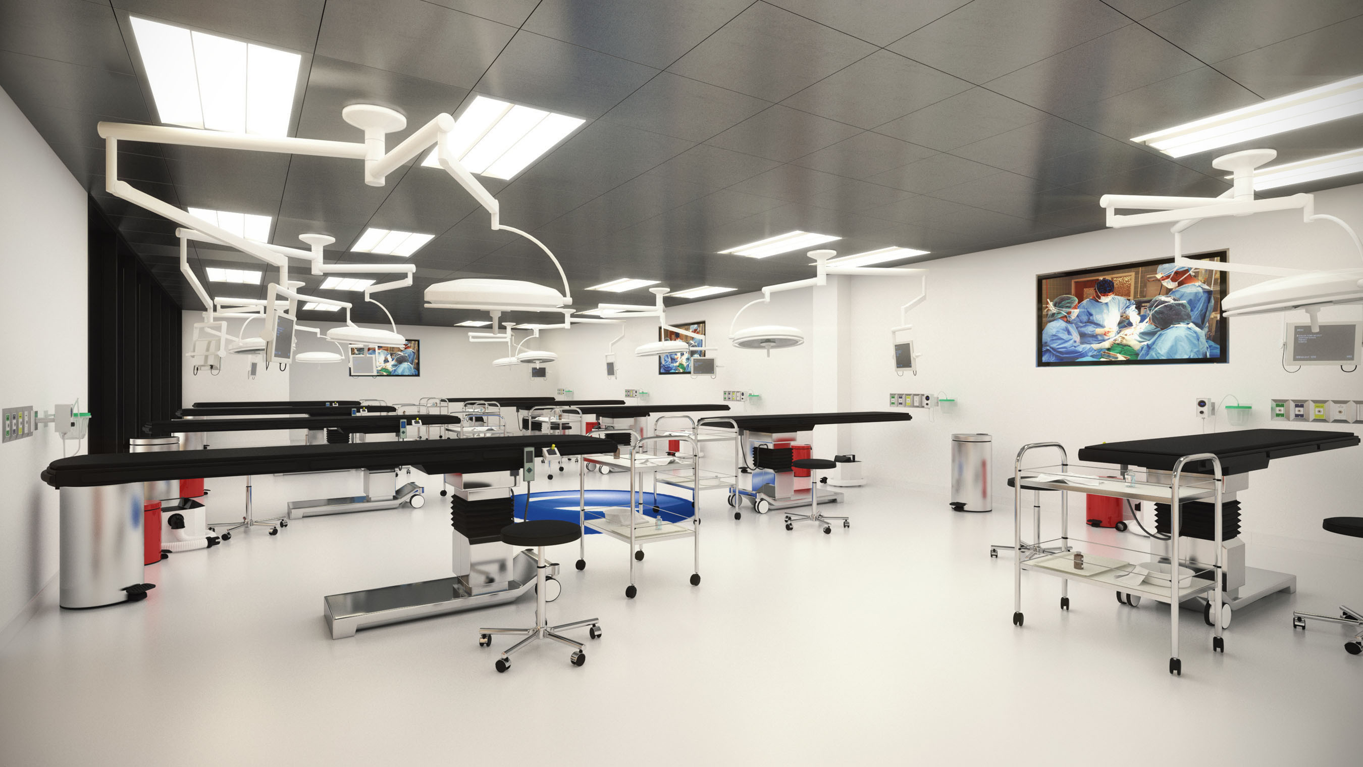 Advanced Centers for Surgical Education multi-station surgical training facility with overhead surgical lights and ORs