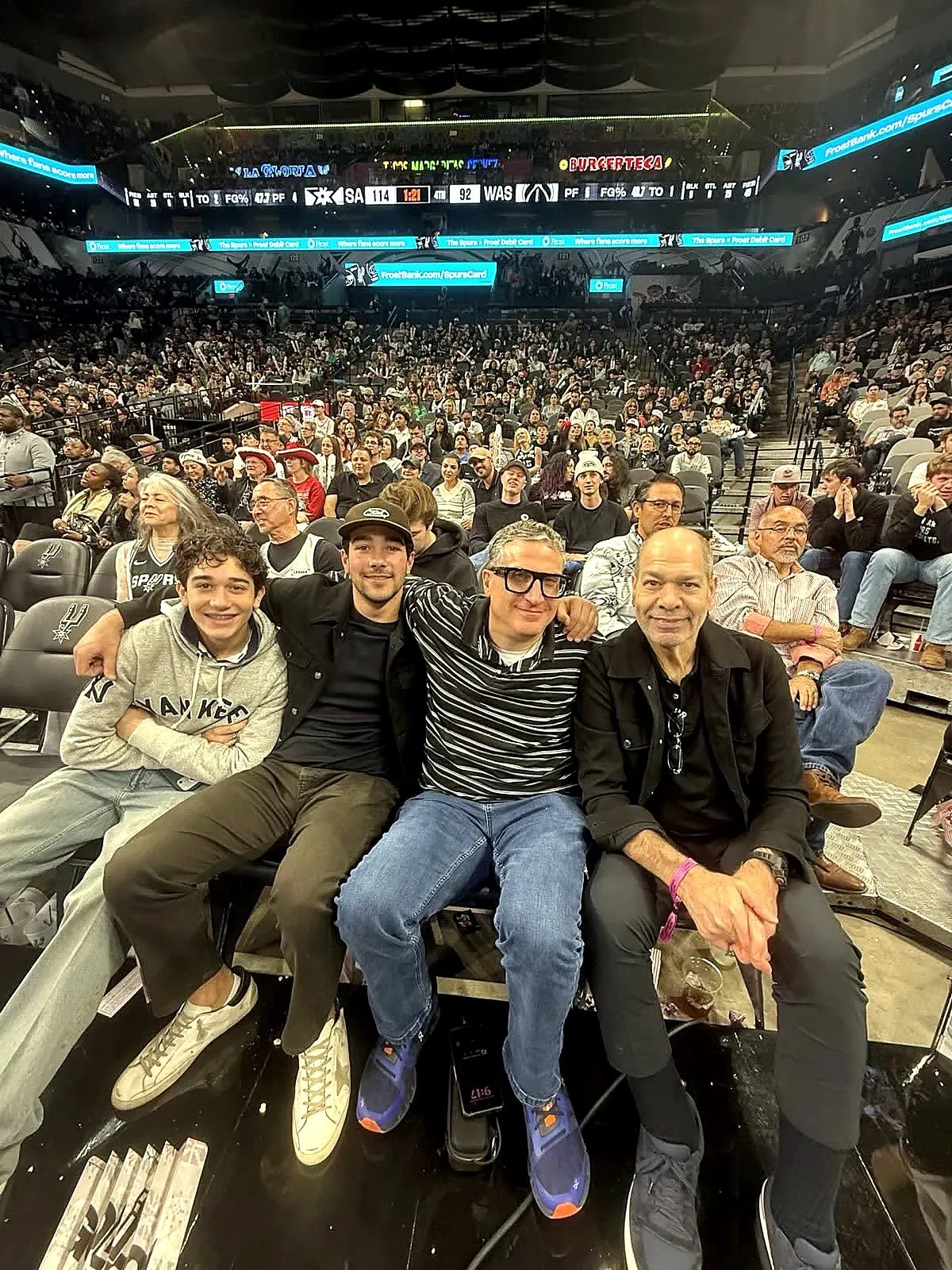 Andrew Jonathan Hillman with others at a basketball game.