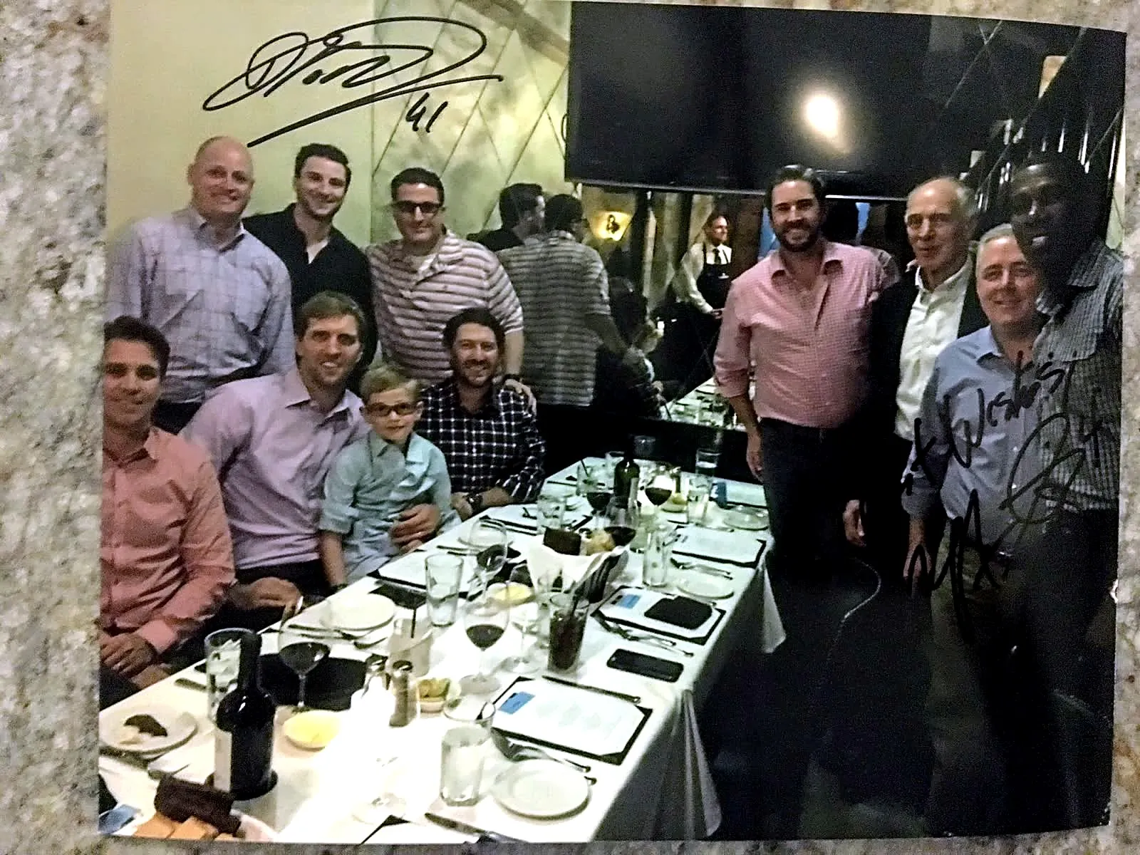 Andrew Jonathan Hillman with others at a dinner.