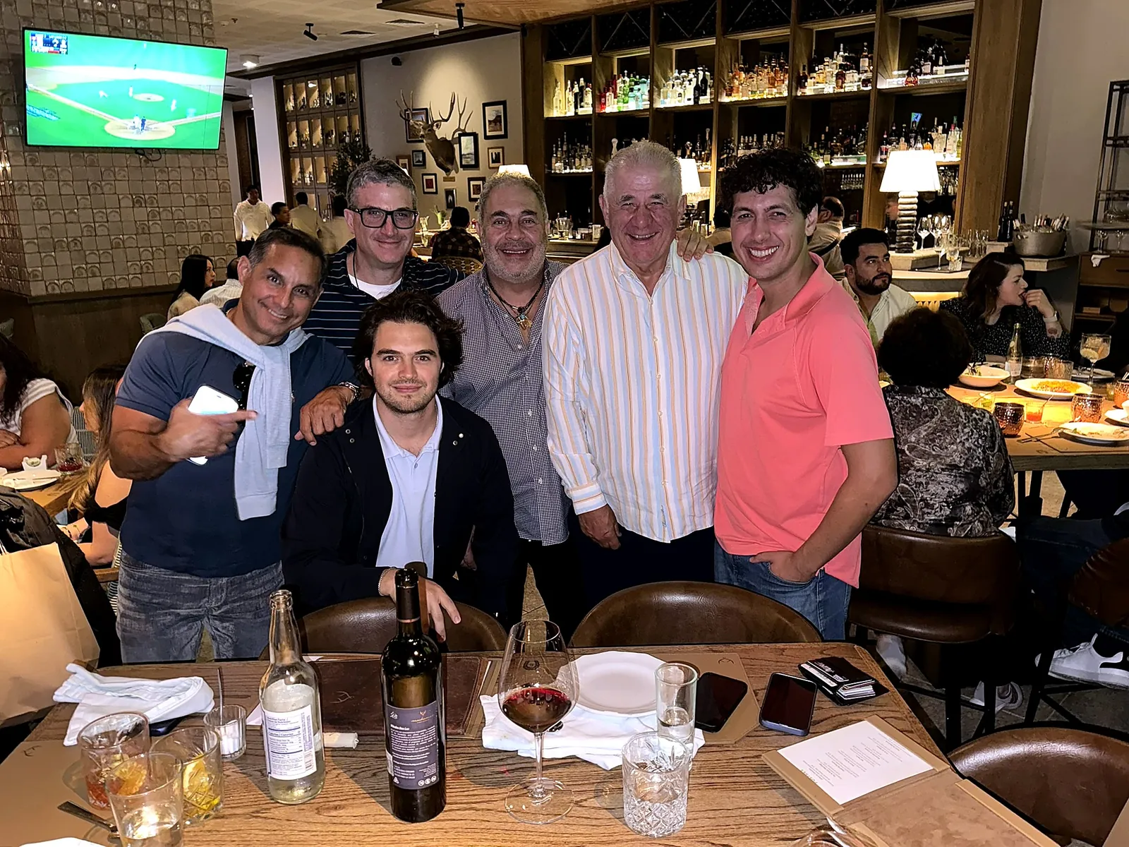 Andrew J. Hillman with friends at a restaurant