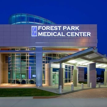Forest Park Medical Center exterior with illuminated facade