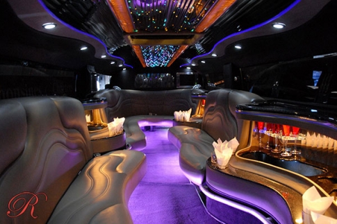 Tag Limousines luxury vehicle interior with leather seating and LED lighting